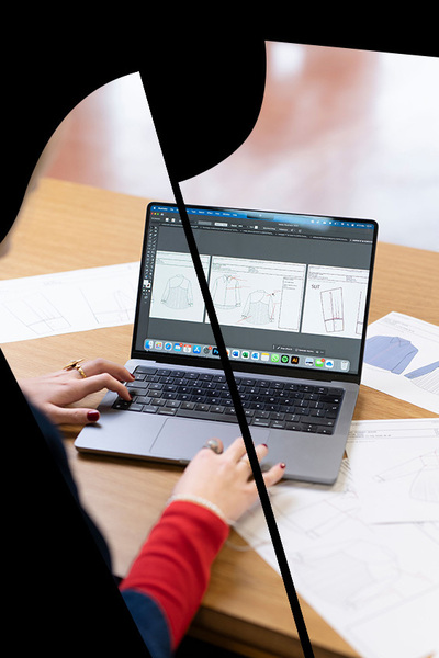 Laptop met kledingontwerpen op scherm